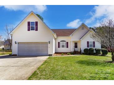 Charming home with a well-manicured lawn, two-car garage and lovely curb appeal at 416 Linsbury Ct, Gastonia, NC 28056