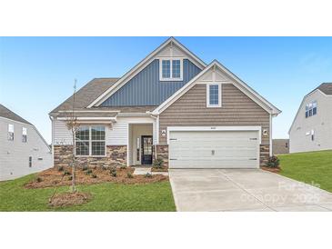 Two-story home with gray and blue siding, stone accents, and a two-car garage at 4469 Doyle Ridge Rd, Maiden, NC 28650