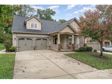 Two-story house with a two-car garage and front porch at 3150 Helmsley Ct, Concord, NC 28027