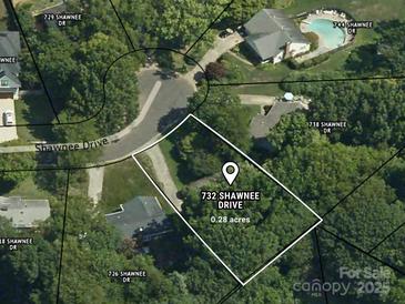 Aerial view of property at 732 Shawnee Drive, approximately 0.28 acres, surrounded by lush greenery and neighborhood homes at 732 Shawnee Dr, Charlotte, NC 28209