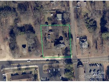 An aerial view of the property with a clearly defined boundary, surrounded by roads and local neighborhood amenities at 305 Huntersville Concord Rd, Huntersville, NC 28078