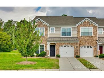 Attractive 2-story townhome with stone accents and a 2-car garage at 5635 Tipperlinn Way, Charlotte, NC 28278