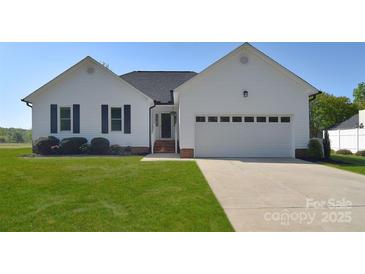 Charming single-story home with white siding, black shutters, and a well-manicured lawn at 217 Dewars Dr, Rock Hill, SC 29730