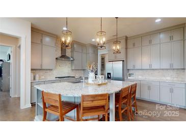 Modern kitchen with an island and gray cabinets at 2402 Paddlers Cove Dr, Clover, SC 29710