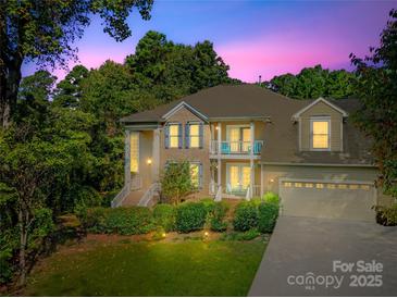 Two-story house with a large front yard, driveway, and attached garage at 141 Red Brook Ln, Mooresville, NC 28117