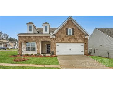 Brick two-story house with a two-car garage and landscaped lawn at 4450 Doyle Ridge Rd, Maiden, NC 28650