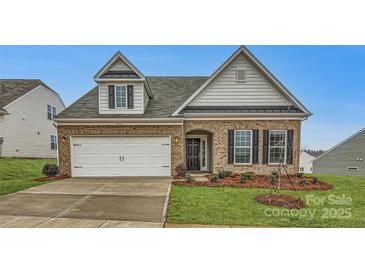 Brick and shingle ranch home with a two-car garage and landscaped lawn at 4456 Doyle Ridge Rd, Maiden, NC 28650