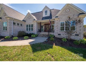 Brick house with a front porch and landscaped yard at 329 Wintergreen Ct, Kings Mountain, NC 28086