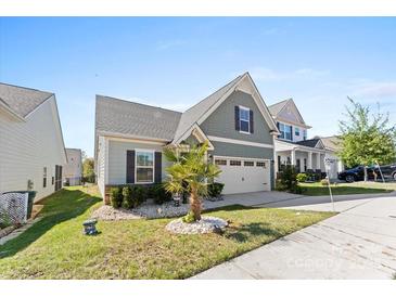 Charming craftsman style home with two-car garage and well-manicured landscaping at 50143 Robins Nest Ln, Lancaster, SC 29720