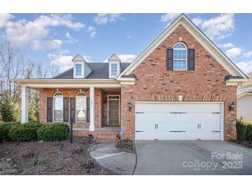 Brick home with a two-car garage and manicured landscaping at 1001 Hatton Ter, Fort Mill, SC 29707