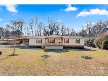 Ranch style home with a covered porch and large yard at 119 Loray Ln, Statesville, NC 28625