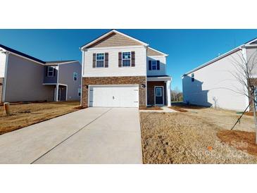 Two-story home with stone accents and a two-car garage at 1025 20Th Avenue Se Way, Hickory, NC 28602