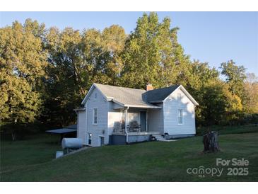 Charming one-story house with a covered porch and large yard at 703 Margate Ave, Kannapolis, NC 28081