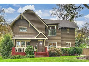 Craftsman style home with brick accents and a well-manicured lawn at 2526 Normandy Rd, Charlotte, NC 28209