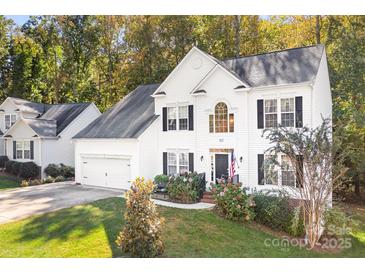 Two-story house with white siding, black shutters, and a two-car garage at 112 Sugar Thyme Ln, Mooresville, NC 28115