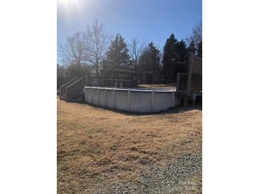 Inviting above ground pool with deck at 8540 Indian Summer Trl, Harrisburg, NC 28075