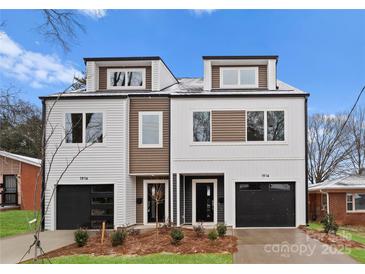 Modern townhomes boast eye-catching curb appeal with stylish exteriors, sleek garage doors, and manicured landscaping at 1914 Irma St, Charlotte, NC 28216