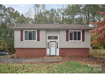 Charming single-Gathering home featuring vinyl siding, red shutters, and a welcoming front entrance with a decorative wreath at 914 Wyke Rd, Shelby, NC 28150