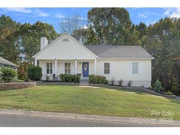 Charming ranch home with a welcoming front porch and landscaped yard at 12017 Baywoods Dr, Tega Cay, SC 29708