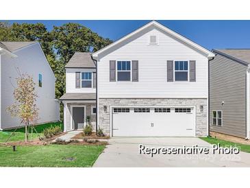 Two-story home with gray stone accents, white siding, and an attached two-car garage at 1027 Freeman View Dr # 151P, Albemarle, NC 28001