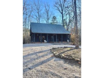 Charming one-story home with metal roof and large front porch at 1386 Old Pinckney Rd, York, SC 29745