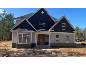 Beautiful new construction home featuring board and batten siding and a welcoming front porch at 227 Heartland Dr, Rock Hill, SC 29732