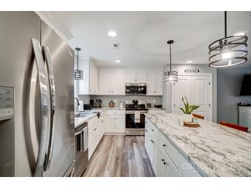 Well-equipped kitchen featuring stainless steel appliances, granite countertops, and custom cabinetry at 3018 Corinth Church Rd, Monroe, NC 28112