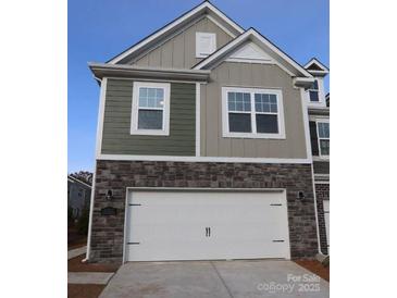 Two-story home with stone and siding accents, two-car garage at 3543 Nimbell Rd, Monroe, NC 28110