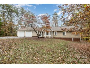 Ranch style home with attached garage and landscaped yard at 2830 Sparrow Springs Rd, Gastonia, NC 28052