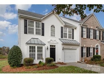 Two-story townhome with white siding and a black door at 105 Beverly Chase Ln, Mooresville, NC 28117