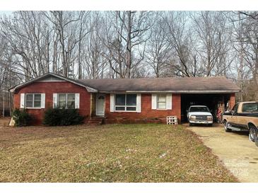 Brick ranch house with carport and mature trees at 1895 Forest Lake Dr, Rock Hill, SC 29732