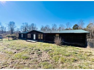 Ranch home with green metal roof and deck at 5199 Helms End Of Trl, Lincolnton, NC 28092