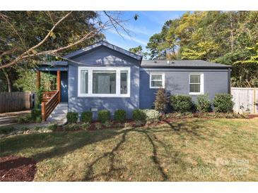 This lovely home features a manicured lawn and tasteful landscaping at 3452 Airlie St, Charlotte, NC 28205