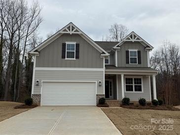 Charming two-story home with a two-car garage, a covered front porch, and decorative gable details at 2387 Trundle Dr # Cwo0155, Gastonia, NC 28054