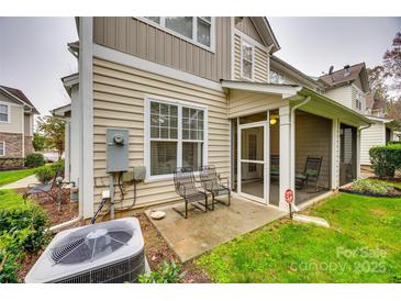 Screened-in back patio with seating area, perfect for relaxing outdoors at 786 Petersburg Dr, Fort Mill, SC 29708