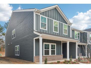 Two-story house with gray siding, white trim, and brick accents at 115 Ciara Pl # A, Mooresville, NC 28117