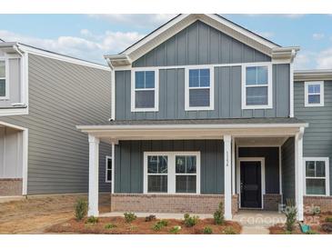 Gray siding, white trim, and a covered porch at 115 Ciara Pl # A, Mooresville, NC 28117