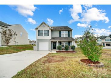 Two-story house with gray siding, white garage door, and landscaping at 1964 Clear Brooke Dr, Kannapolis, NC 28083