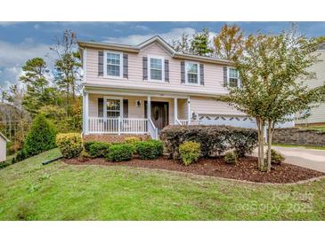 Two-story house with light pink siding, landscaping, and a two-car garage at 160 Hedgewood Dr, Mooresville, NC 28115