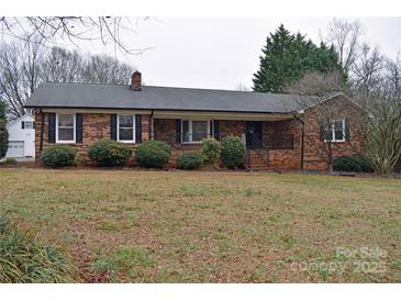 Charming brick home with mature landscaping and inviting front entrance at 115 Turner St, Lincolnton, NC 28092