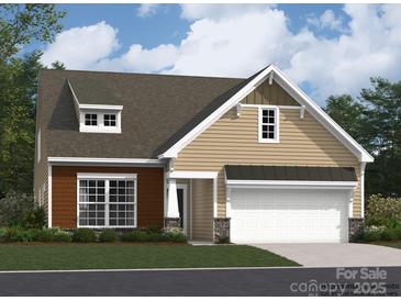 Attractive craftsman style home with two-tone siding and a two-car garage at 1987 Copper Path Dr, Fort Mill, SC 29715