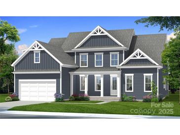 Charming two-story home with a manicured lawn, attached garage, and beautiful architectural details at 4265 Candlewood Dr, Sherrills Ford, NC 28673