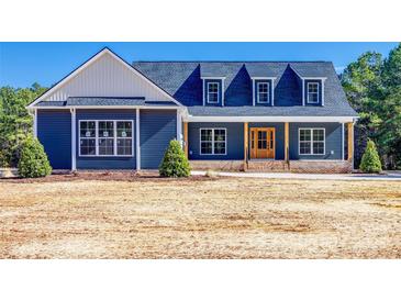 Craftsman style home with blue siding, white accents, and a large front porch at 636 Edwards Rd, Fort Lawn, SC 29714