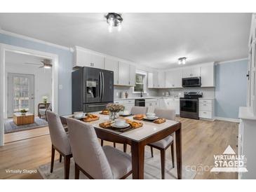 Renovated kitchen with stainless steel appliances and dining area at 1485 Nc Hwy 16 N Hwy, Taylorsville, NC 28681