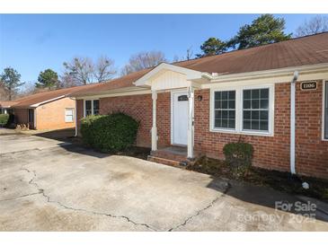 Charming brick home featuring a well-maintained front yard and inviting entrance at 1106 Chandler Dr, Rock Hill, SC 29732