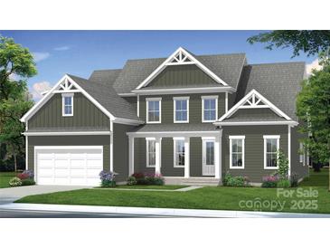 Charming two-story home featuring a covered porch, attached garage, and a beautifully landscaped front yard at 4271 Candlewood Dr, Sherrills Ford, NC 28673