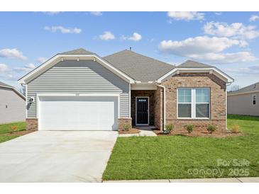 Charming single-Gathering home with a two-car garage, brick and siding exterior, and manicured front lawn at 1133 Hallman Branch Ln, Lincolnton, NC 28092
