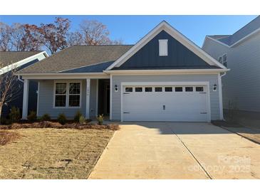Two-toned exterior of charming new home with attached garage at 1054 Bull Dog Ln, Wingate, NC 28174