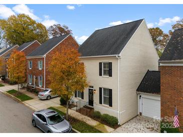 Two story brick home with attached garage and landscaped yard at 548 Summerfield Pl, Belmont, NC 28012