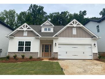 Charming single-Gathering home with a 2-car garage, inviting entrance, and manicured lawn at 9130 Dulwich Dr # Ken0079, Charlotte, NC 28215